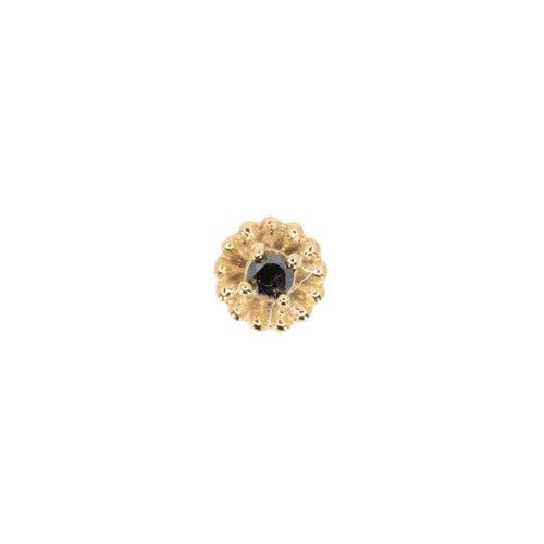 Yellow gold push pin earring in a floral shape with a black diamond center.