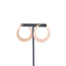 A pair of rose gold plated earrings with beaded accents.