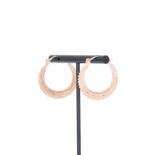 A pair of rose gold plated earrings with beaded accents.