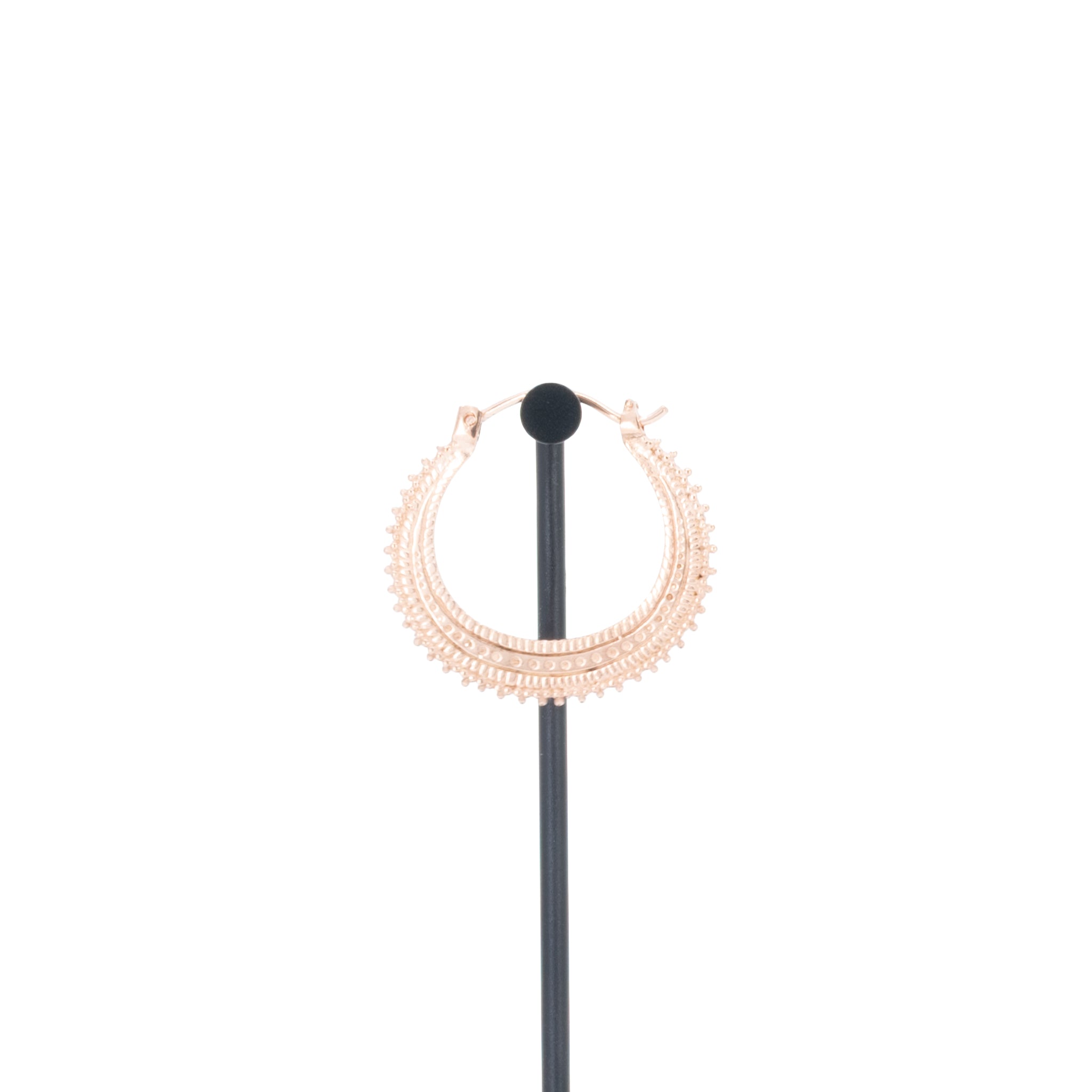 A single rose gold plated earring with beaded accents.