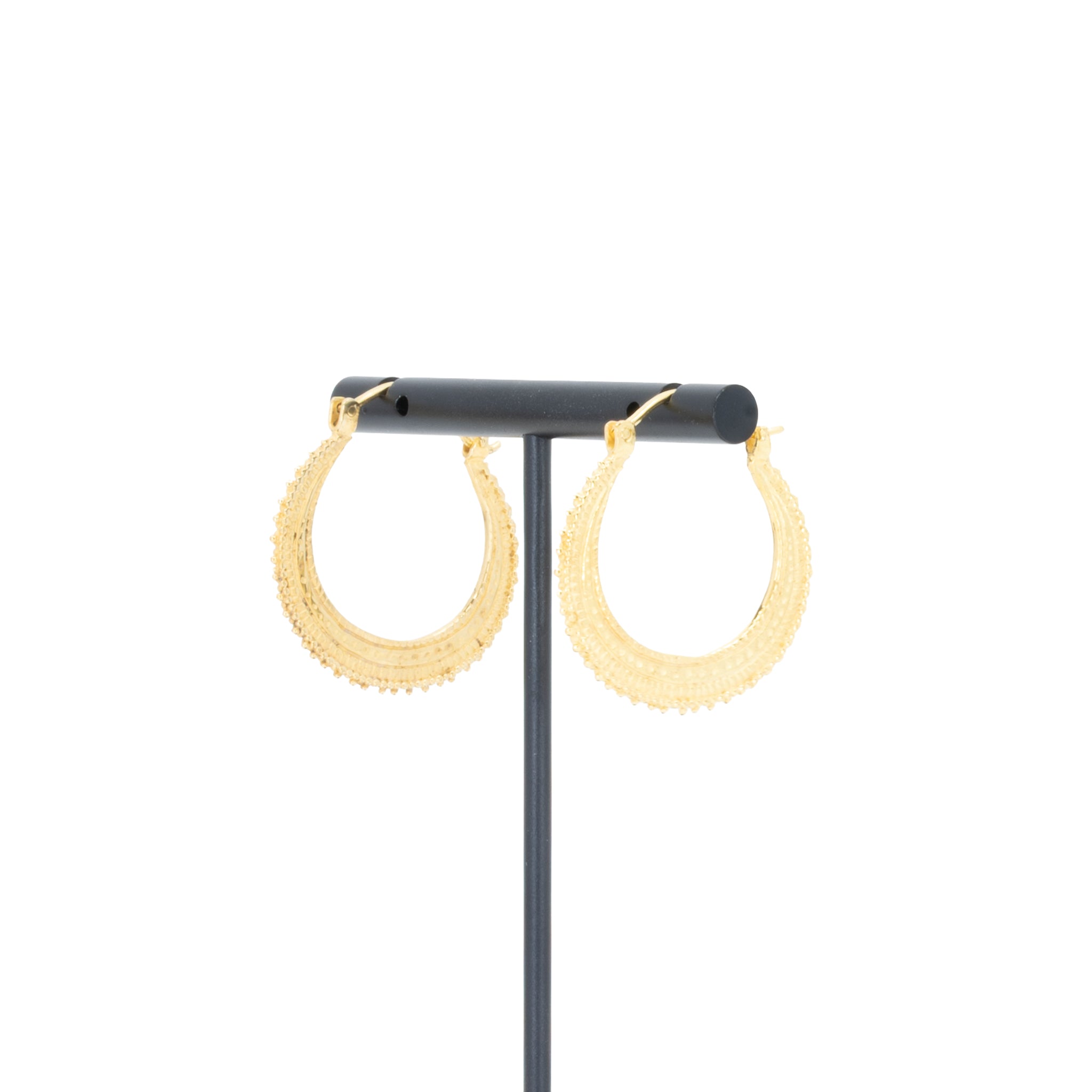 A pair of yellow gold plated earrings with bead accents.