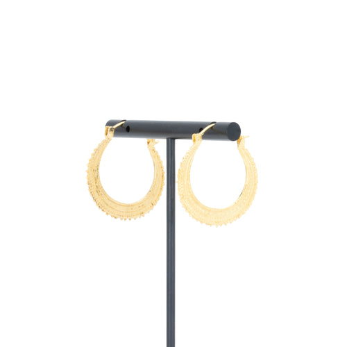 A pair of yellow gold plated earrings with bead accents.
