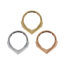 Three seam rings with a sandblasted geometric decorative section that comes to a point. One yellow gold, one white gold, and one rose gold.