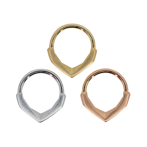 Three seam rings with a sandblasted geometric decorative section that comes to a point. One yellow gold, one white gold, and one rose gold.