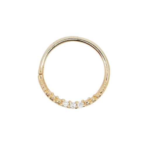 Yellow gold seam ring with three round white diamonds and beaded accents.