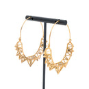 A pair of yellow gold plated hoop earrings with the decorative portion created by varying sizes of hollow triangles.
