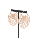 A pair of rose gold plated hoop earrings with the decorative portion created with hollow overlapping tapered ovals creating a floral design.