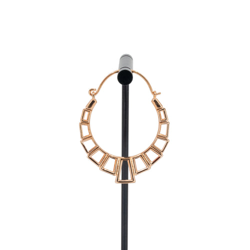 A single rose gold plated hoop earring with the decorative portion created with hollow rectangles and squares.