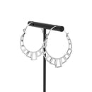 A pair of silver plated hoop earrings with the decorative portion created with hollow rectangles and squares.
