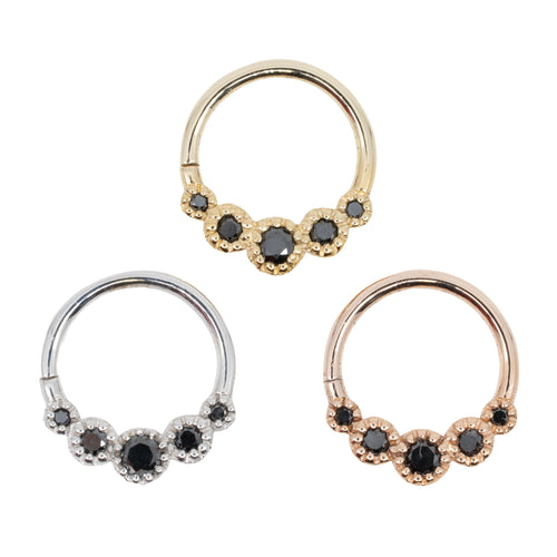 Three gold seam rings with five round prong set black diamond accents. One yellow gold, one white gold and one rose gold.