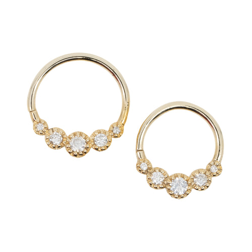 Two yellow gold seam rings with five round prong set white diamond accents. Two different diameters.