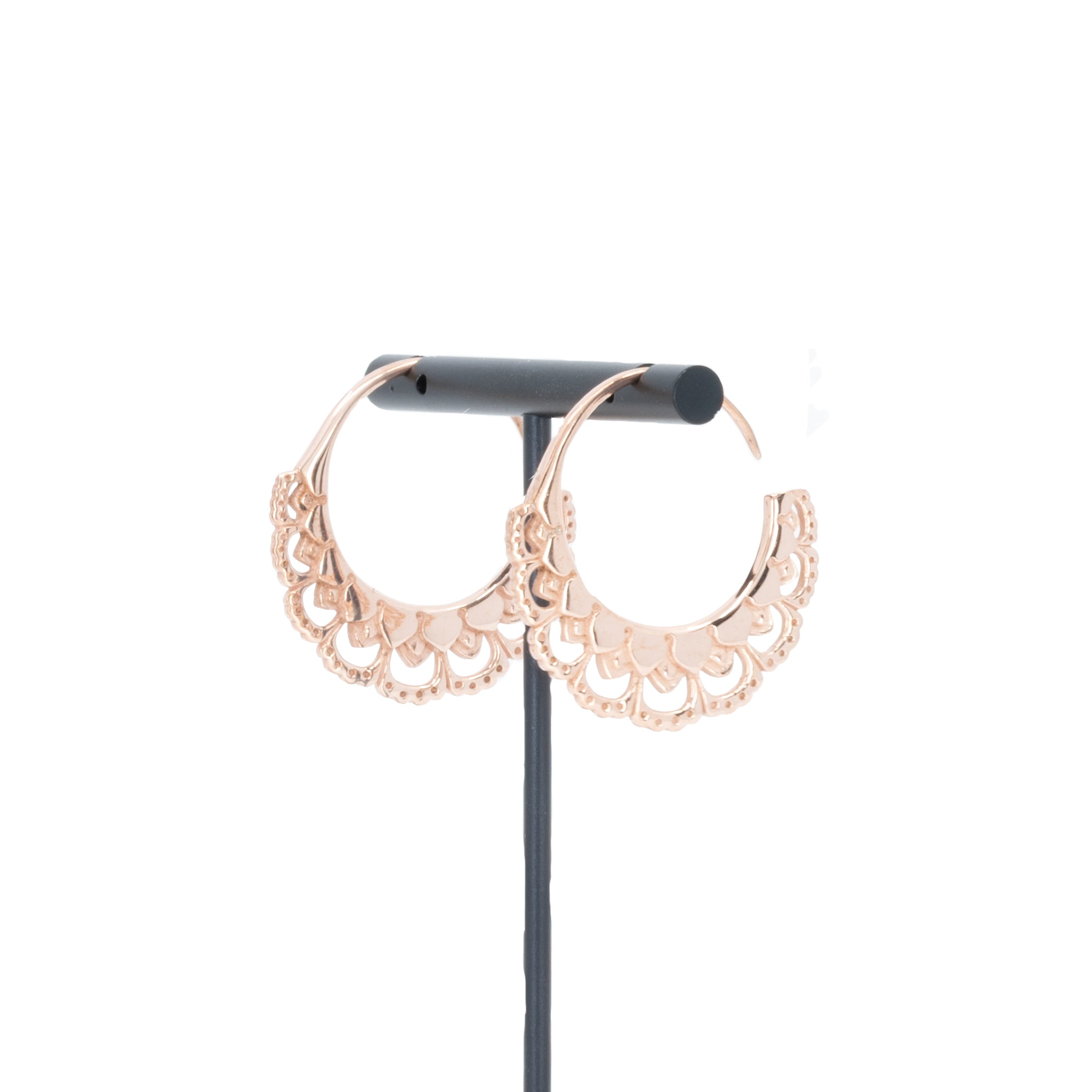 A pair of rose gold plated hoop earrings with petal details.