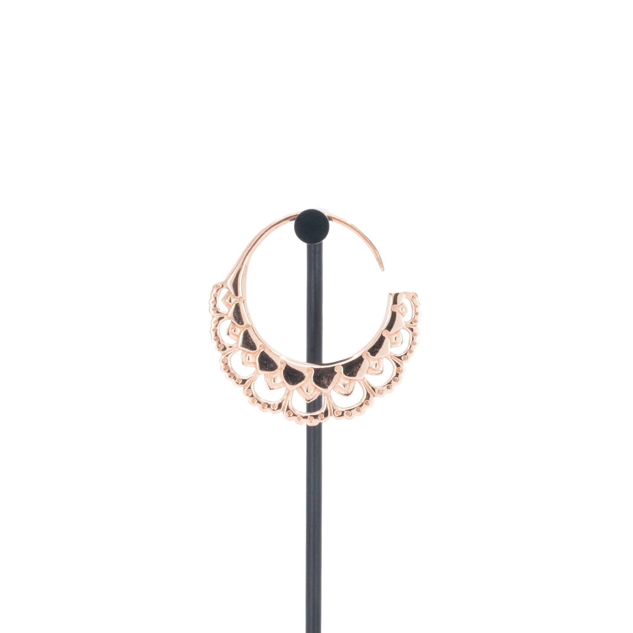 A single rose gold plated hoop earrings with flower petal details.