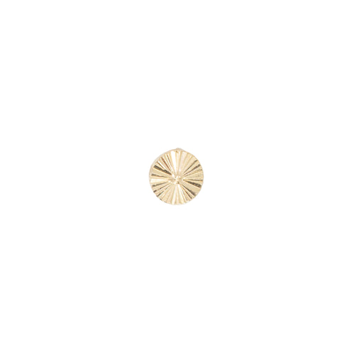 Yellow gold push pin earring of a flat small disk with etched lines pointing toward the center.