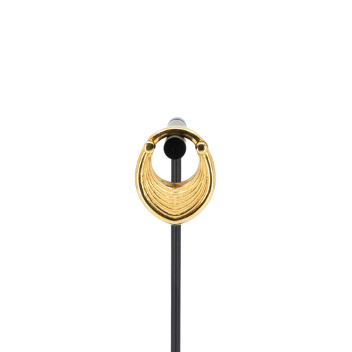 A single yellow gold plated weight in a soft teardrop shape with a laser etched line pattern on the outside.