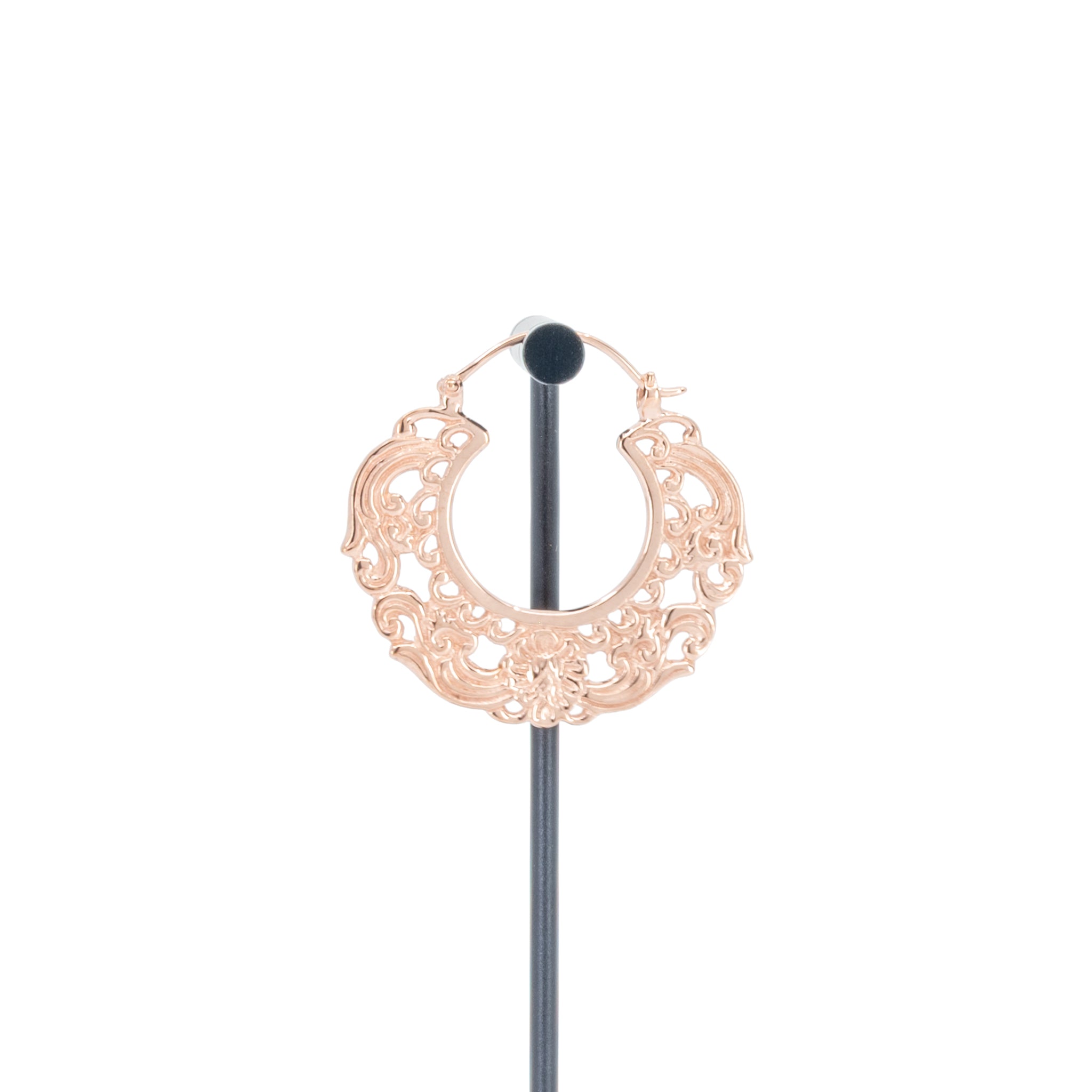 A single rose gold plated hoop earrings with decorative scroll work accents.