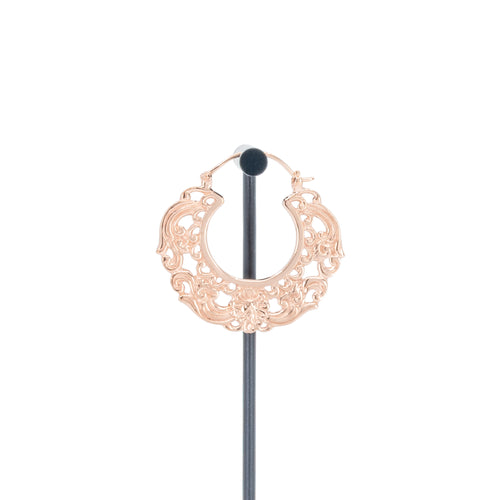 A single rose gold plated hoop earrings with decorative scroll work accents.