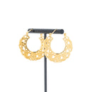 A pair of yellow gold plated hoop earrings with decorative scroll work accents.
