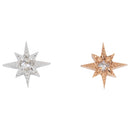 Two laser etched star shaped push pin earrings with a reversed prong set round white diamond in the center. One in white gold and one in rose gold.