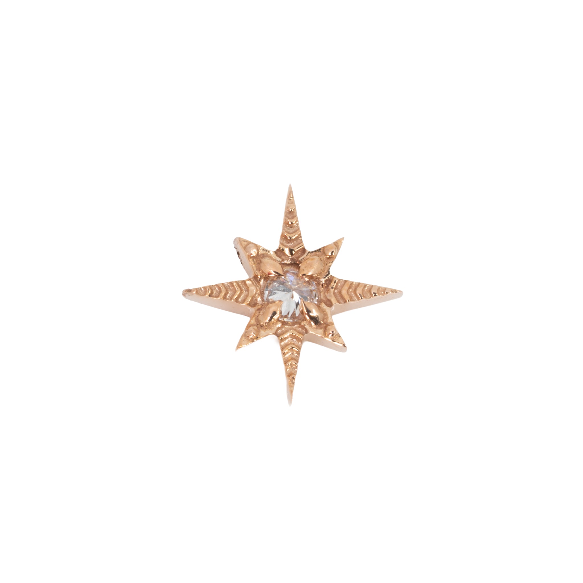 A rose gold laser etched star shaped push pin earring with a reversed prong set round white diamond in the center. 