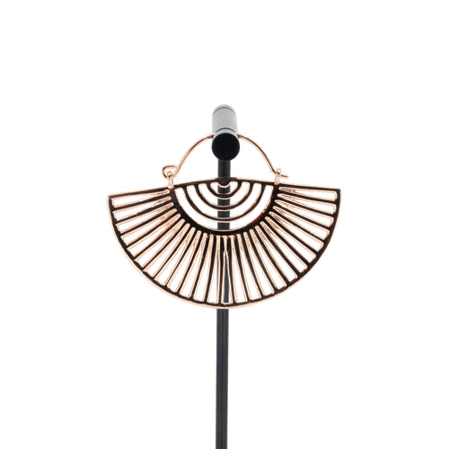 A single rose gold plated hoop earring with a half circle fan design with half circle and elongated triangle cutouts.