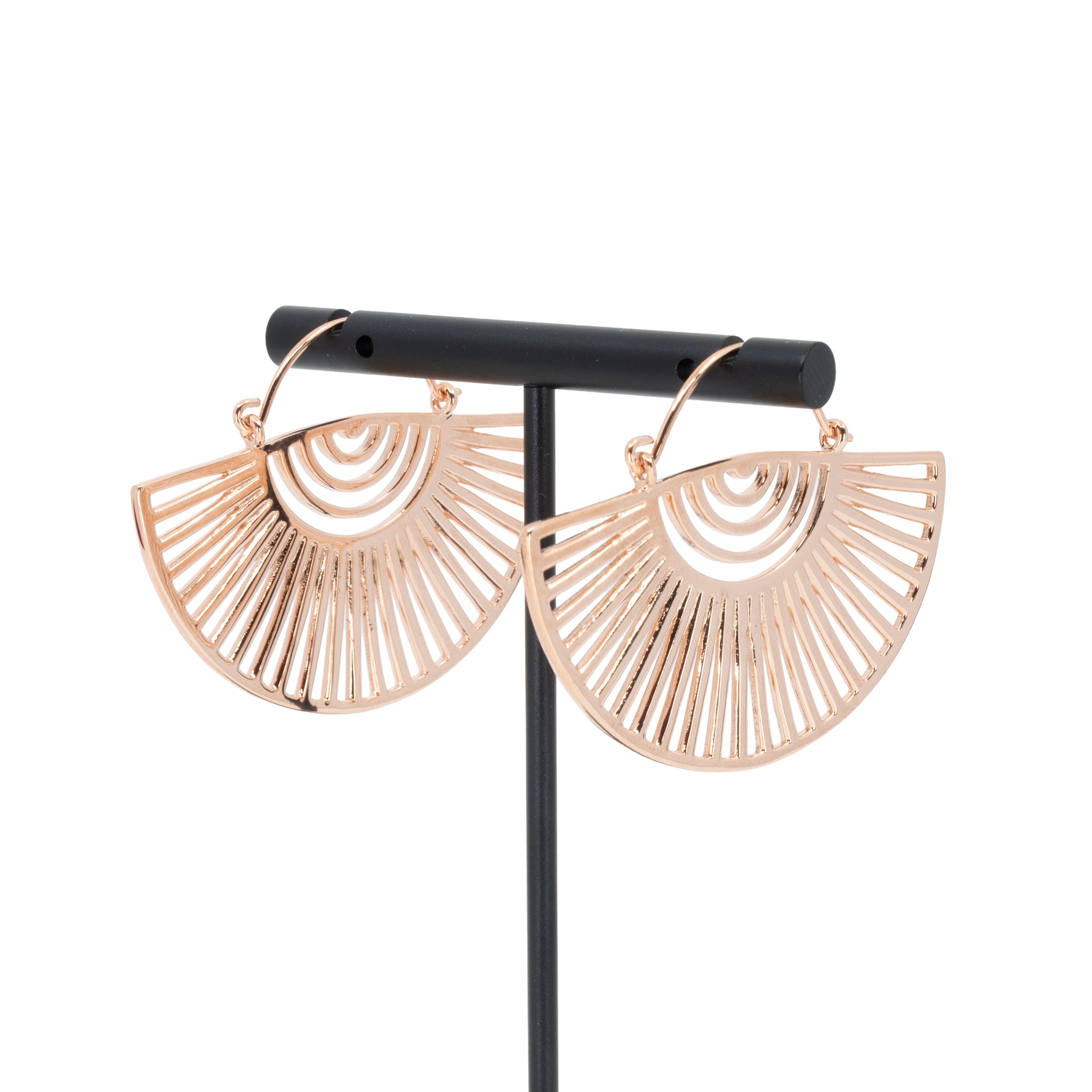 A pair of rose gold plated hoop earrings with a half circle fan design with half circle and elongated triangle cutouts.
