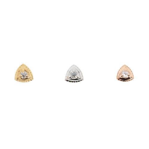 Three gold push pin earrings with one round reverse set white diamond in the center of a gold triangle with crimping along the edges. one yellow gold, one white gold, and one rose gold.