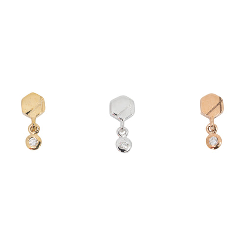 Three laser etched hexagon push pin earrings with bezel set round white diamond dangles. One yellow gold, one white gold, and one rose gold.