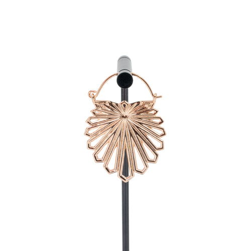 A rose gold plated hoop earring with a floral design that uses kite shapes to create the petals.