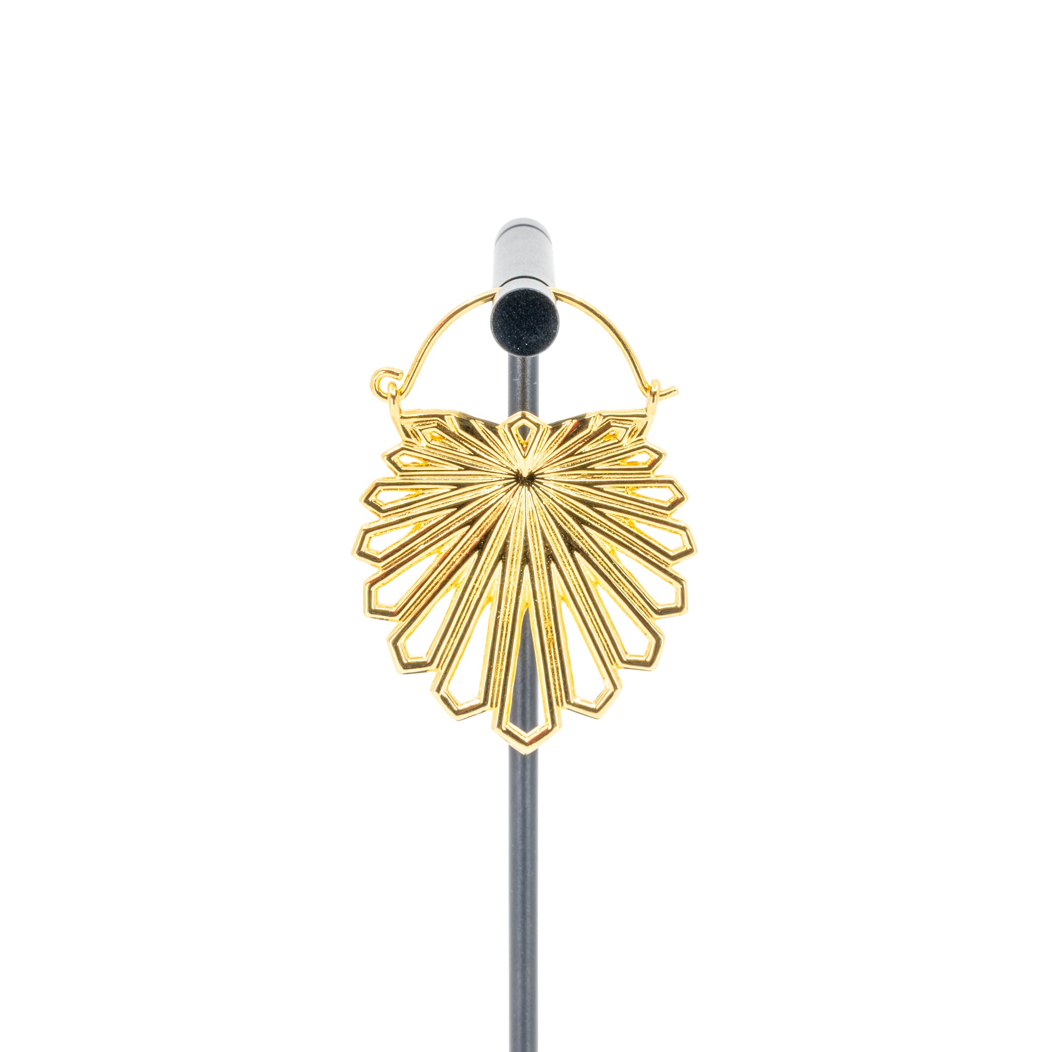 A single yellow gold plated hoop earring with a floral design that uses kite shapes to create the petals.