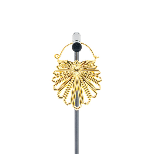 A single yellow gold plated hoop earring with a floral design that uses kite shapes to create the petals.