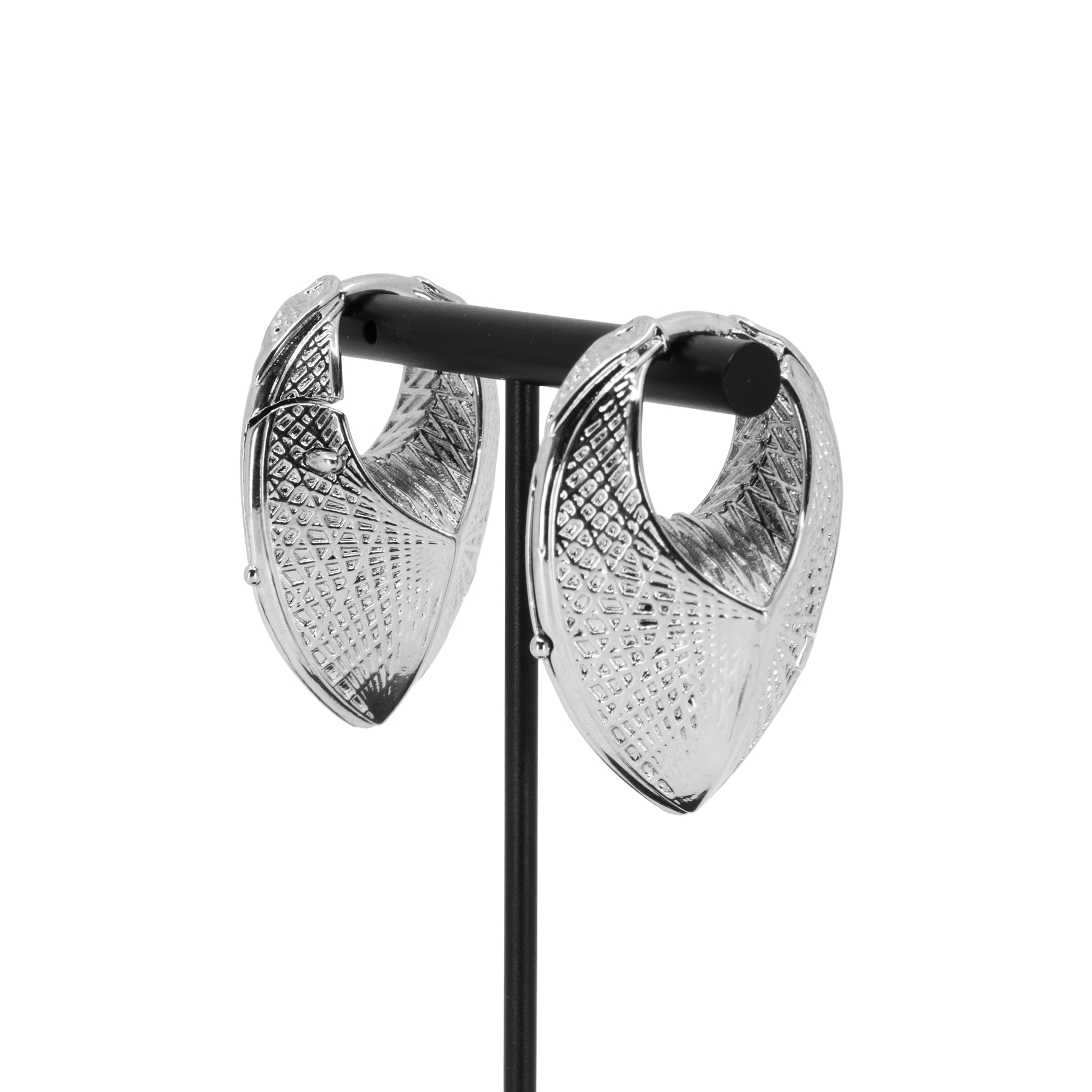 A pair of white bronze weights in a teardrop shape with a laser etched geometric pattern on the outside.