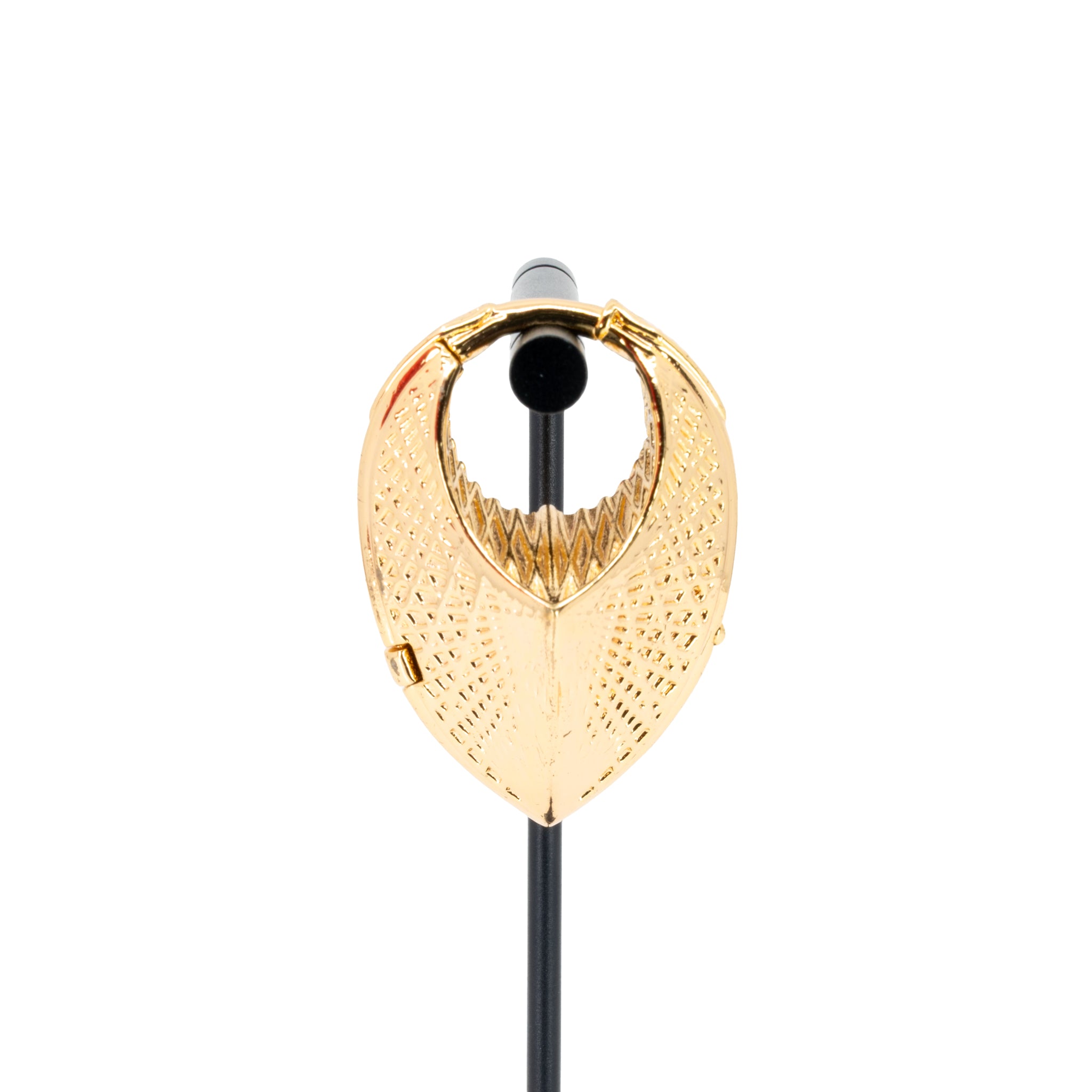 A single yellow gold plated weight in a teardrop shape with a laser etched geometric pattern on the outside.