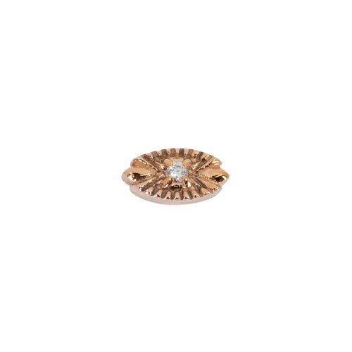 A round diamond stud push pin earring in a prong setting on a rose gold oval with laser etched accents pointing toward the center. 