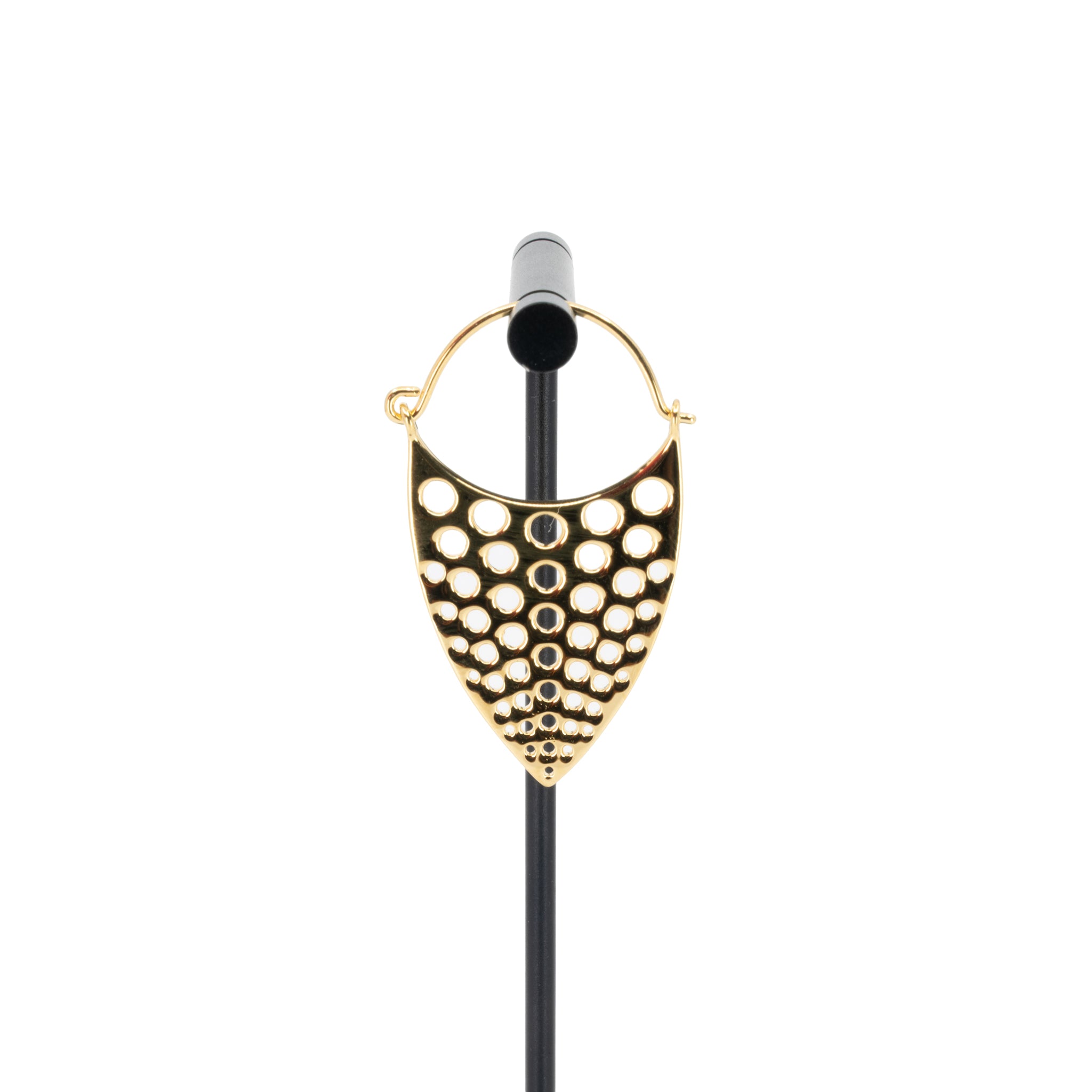 A single yellow gold plated hoop earring with a teardrop design that has hole cutouts.