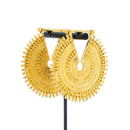A pair of ornate yellow gold weights with intricate concentric beadwork.