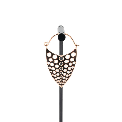 A single rose gold plated hoop earring with a teardrop design that has hole cutouts.