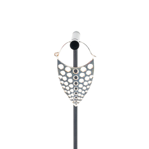A single silver plated hoop earring with a teardrop design that has hole cutouts.
