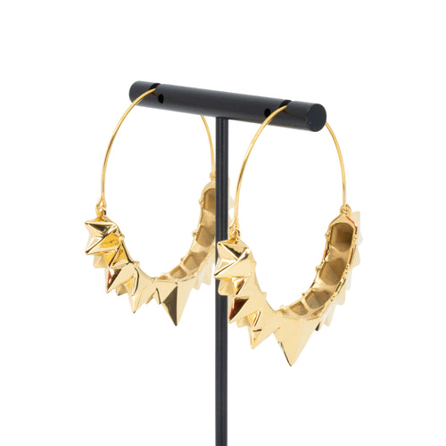A pair of yellow gold plated hoop earrings with the decorative portion created by varying sizes of solid triangles.