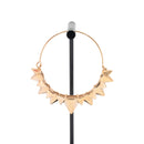 A single rose gold plated hoop earring with the decorative portion created by varying sizes of solid triangles.