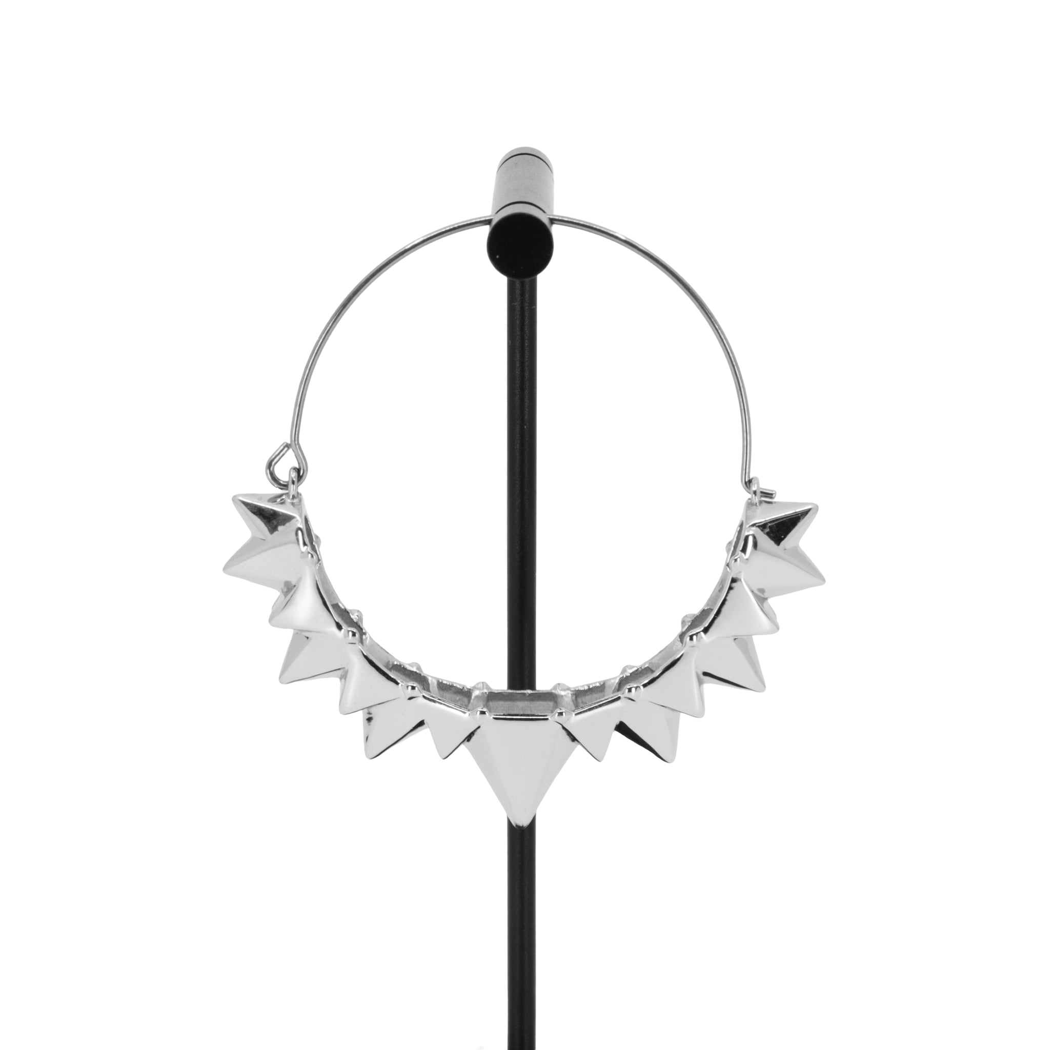 A single silver plated hoop earring with the decorative portion created by varying sizes of solid triangles.
