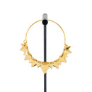 A single yellow gold plated hoop earring with the decorative portion created by varying sizes of solid triangles.