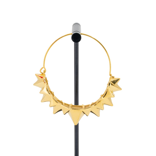 A single yellow gold plated hoop earring with the decorative portion created by varying sizes of solid triangles.