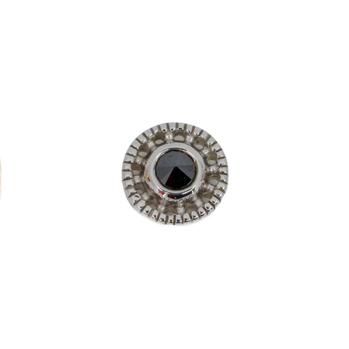 White gold push pin earring in a circular design with scalloped edges and a reverse set black diamond bezel center. 