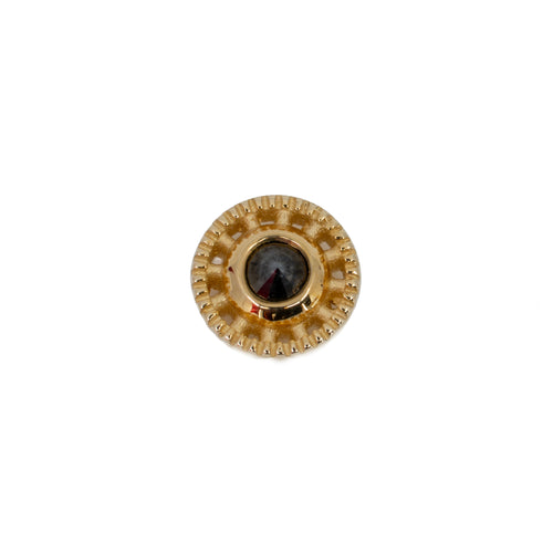 Yellow gold push pin earring in a circular design with scalloped edges and a reverse set black diamond bezel center. 