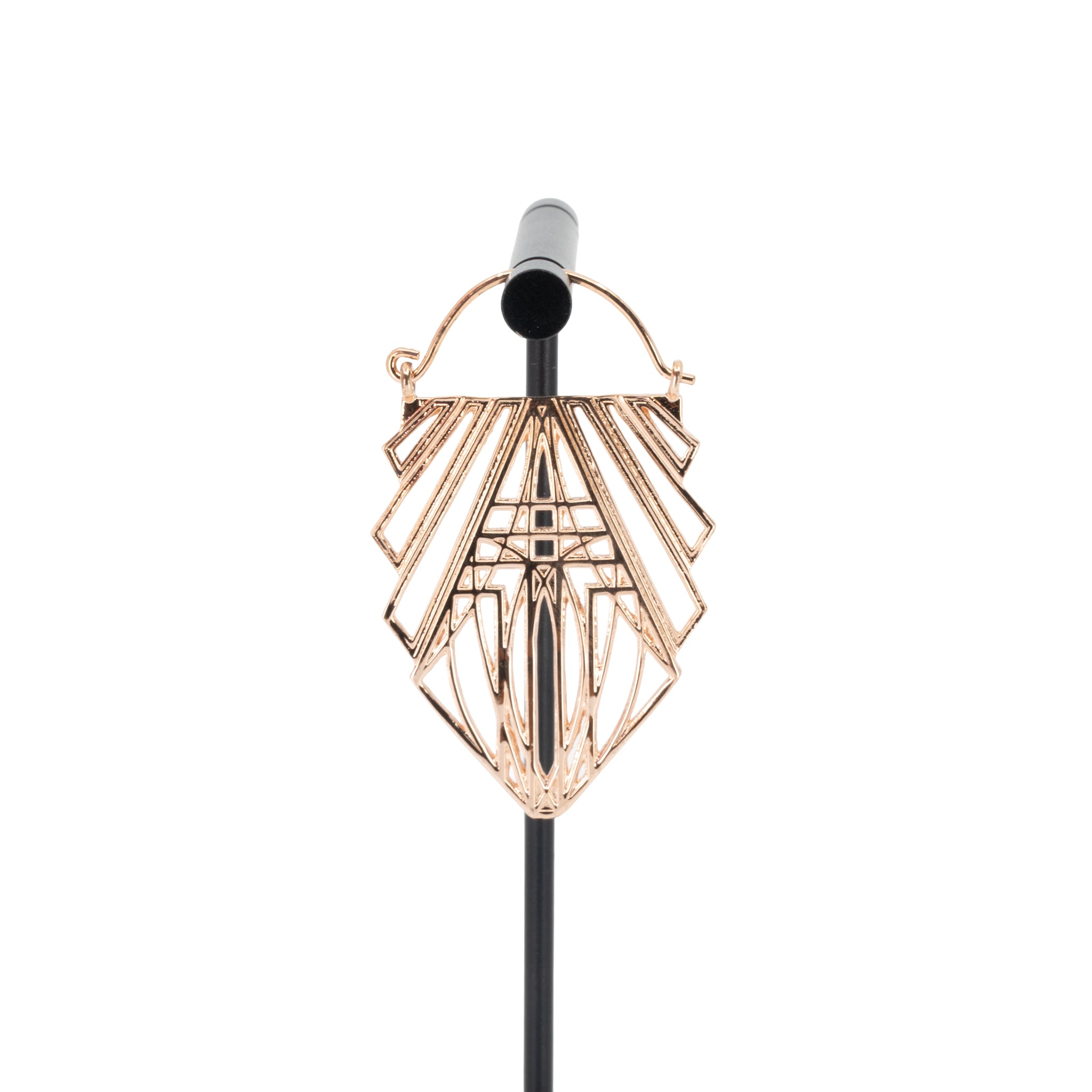 A rose gold plated hoop earring in a geometric design created with straight lines and rectangles.
