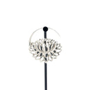A single silver hoop earrings with a lotus at the bottom.