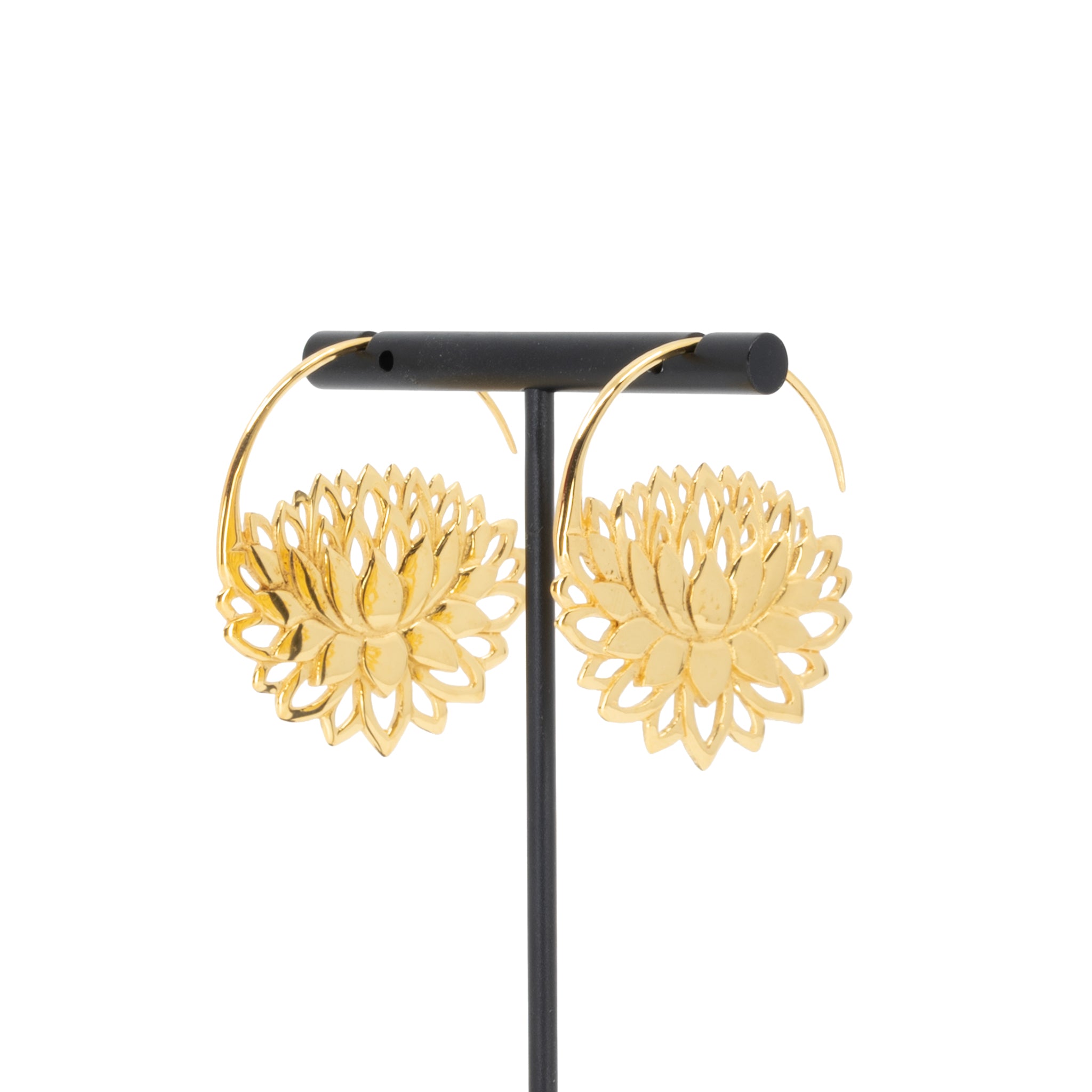 A pair of  yellow gold plated hoop earrings with a lotus at the bottom.