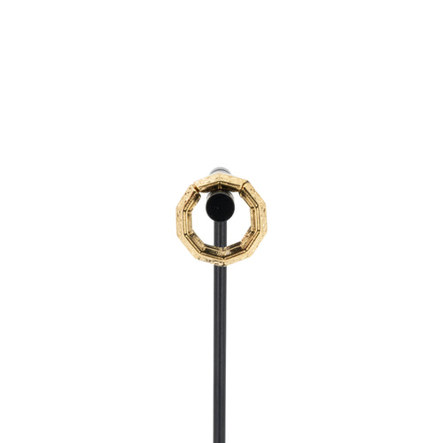 A single yellow gold plated weight in a decagon shape with a laser etched pattern on the outside.