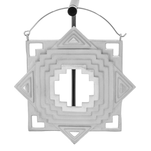 An extra large single stainless steel hoop earring with a geometric design and a cut out in the center and in the four corners.
